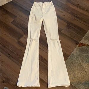 White bellbottoms distressed knees